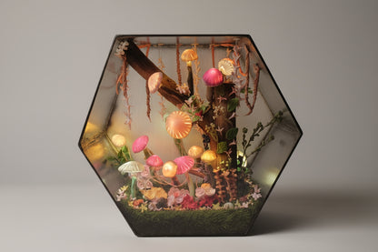 Hexagonal diorama with colorful jellyfish-like creatures on a dark background